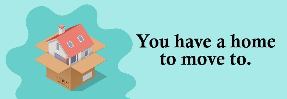 A house inside a moving box, with the text 