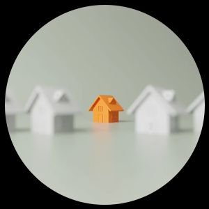 Orange house stands out among white houses.