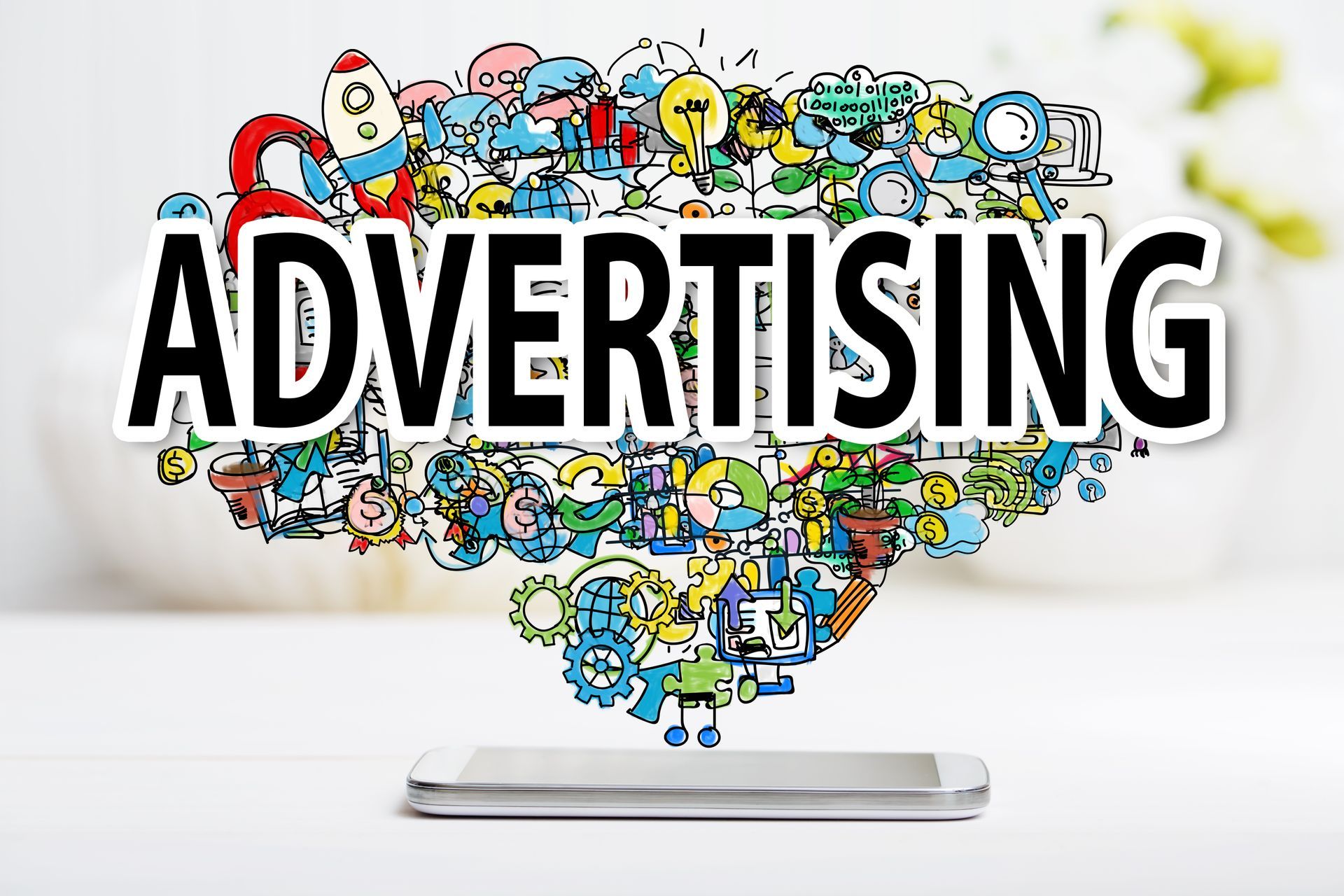 The word advertising is coming out of a cell phone.