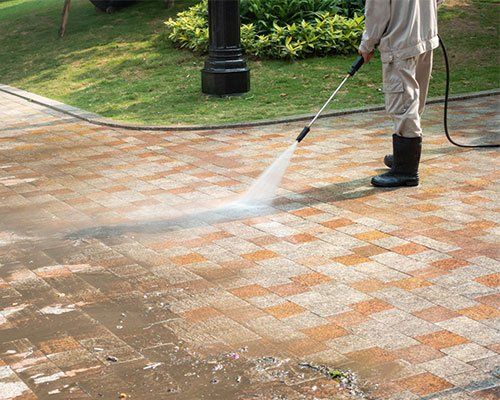An Outdoor Walkway Being Pressure Cleaned — Tropical Cleaning Services in Innisfail, QLD