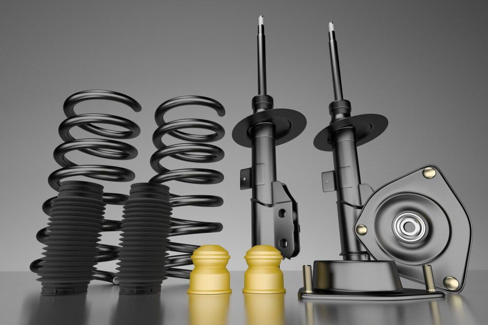 A Group of Shock Absorbers and Springs Are Sitting on A Table — Multidrive Parts Australia in Taminda, NSW