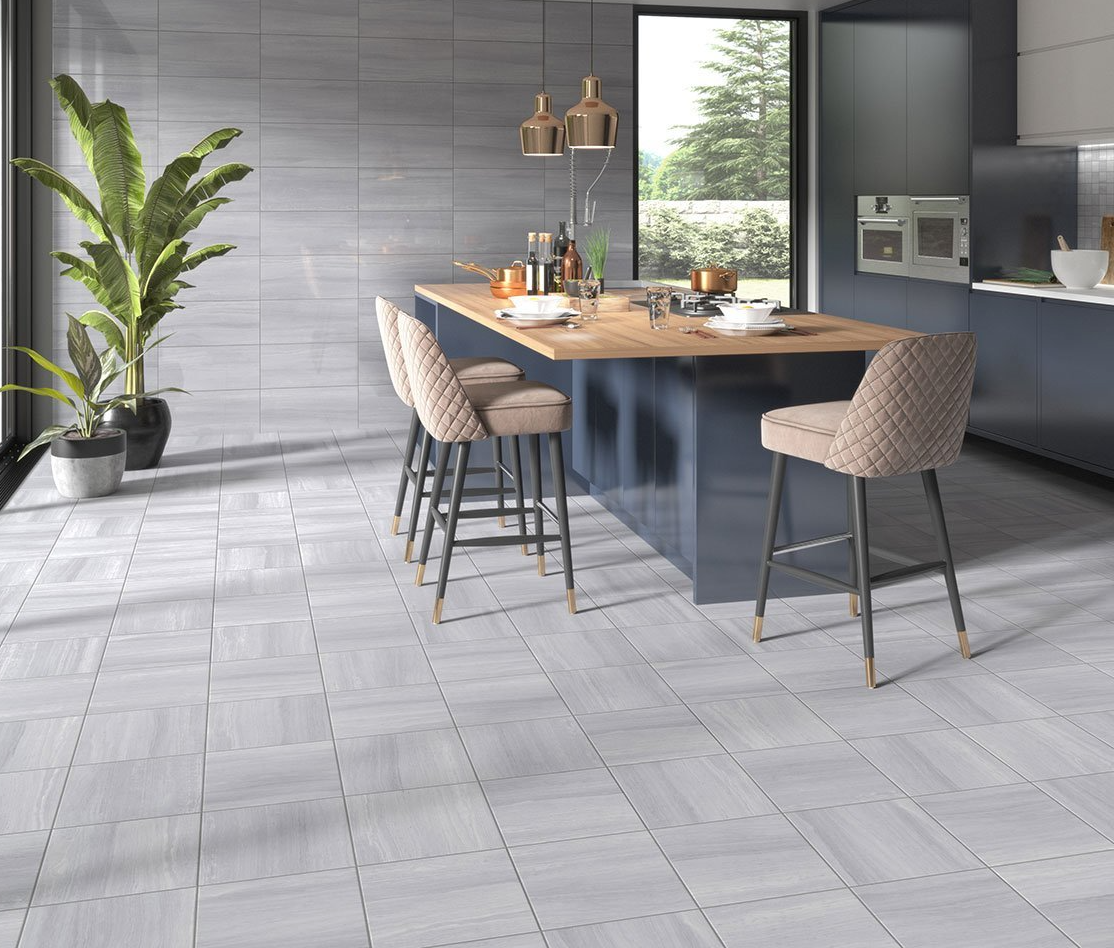 Ceramic tile in a beautiful dark kitchen with beige chairs around a dinner table