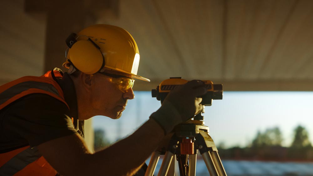 Man Using Survey Camera — Floresville, TX — Polluck & Sons Surveying Inc.