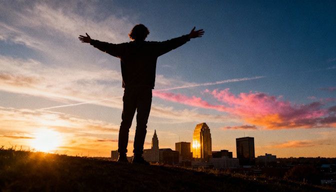 A Dayton skyline at sunset symbolizing overcoming fear and freedom