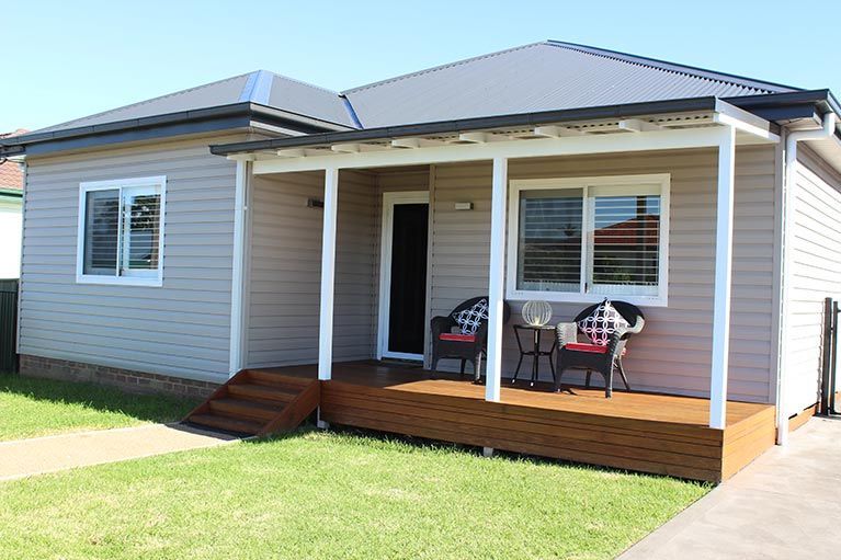 House with Wooden Deck — Simclad Home Improvements in Wollongong