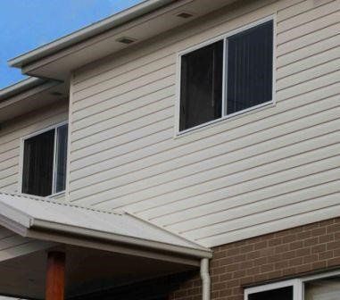 Side of House with Wall Cladding — Simclad Home Improvements in Wollongong