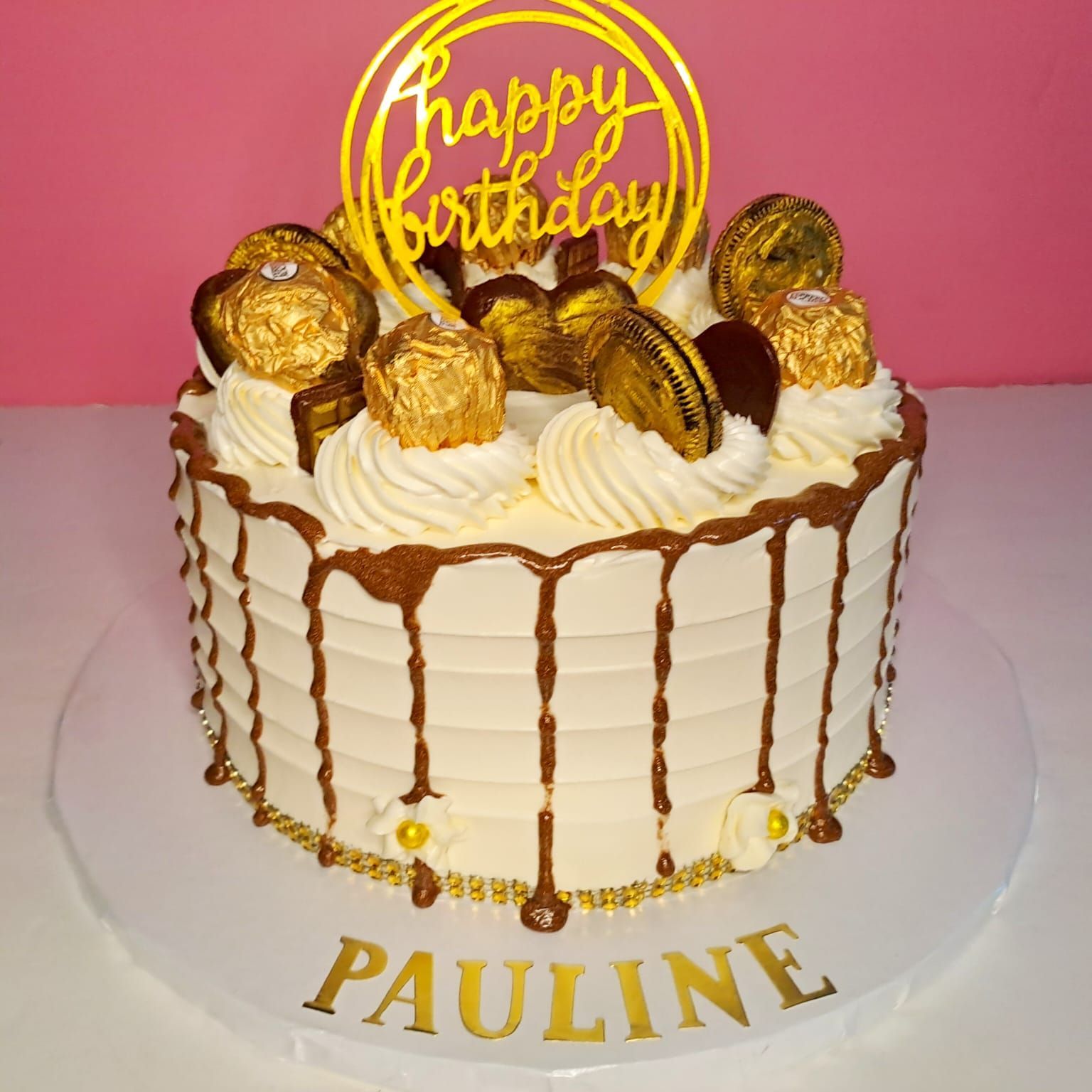 A birthday cake with the name pauline on it
