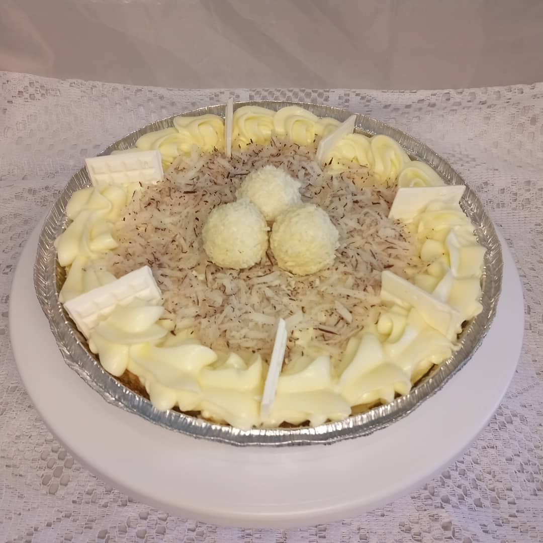 A casserole dish filled with mashed potatoes and cheese