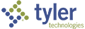 A blue and green logo for tyler technologies