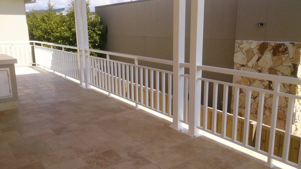 A Balcony With a White Railing and a Tiled Floor — Riverside Aluminium & Stainless in Coolongolook, NSW