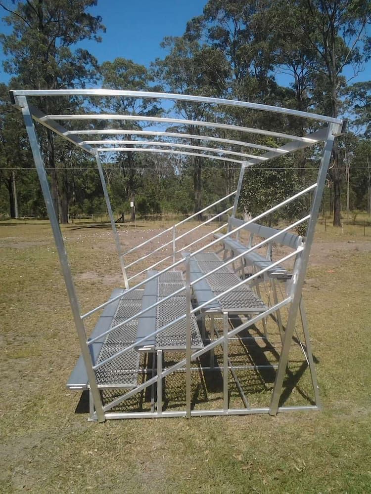 A Metal Structure is Sitting in the Middle of a Grassy Field — Riverside Aluminium & Stainless in Forster, NSW