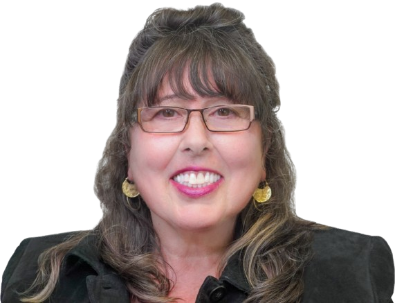 A woman wearing glasses and earrings is smiling for the camera.