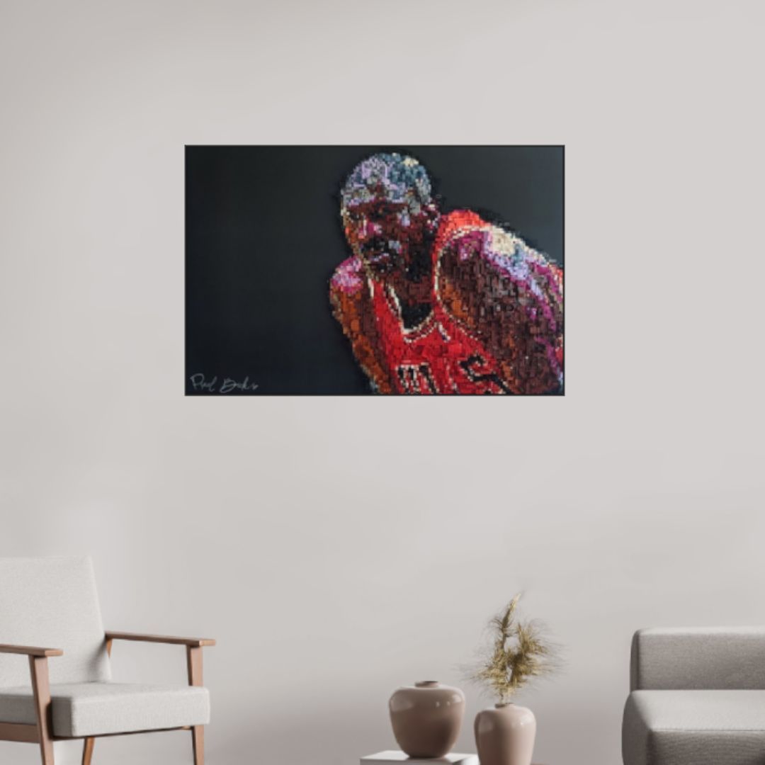 Peinture de Michael Jordan en maillot rouge sur fond sombre. Signée en bas à gauche.