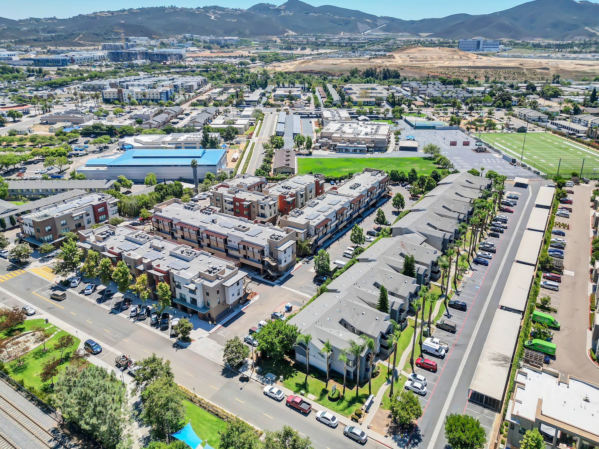An aerial view of a city with a lot of buildings and trees.