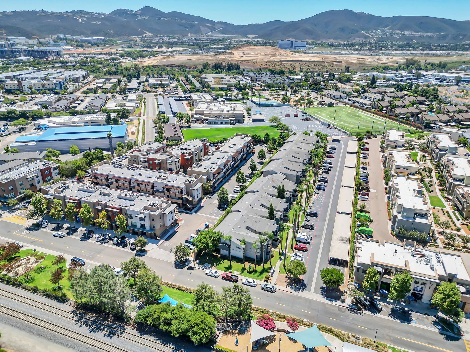 An aerial view of a city with a lot of buildings and trees.
