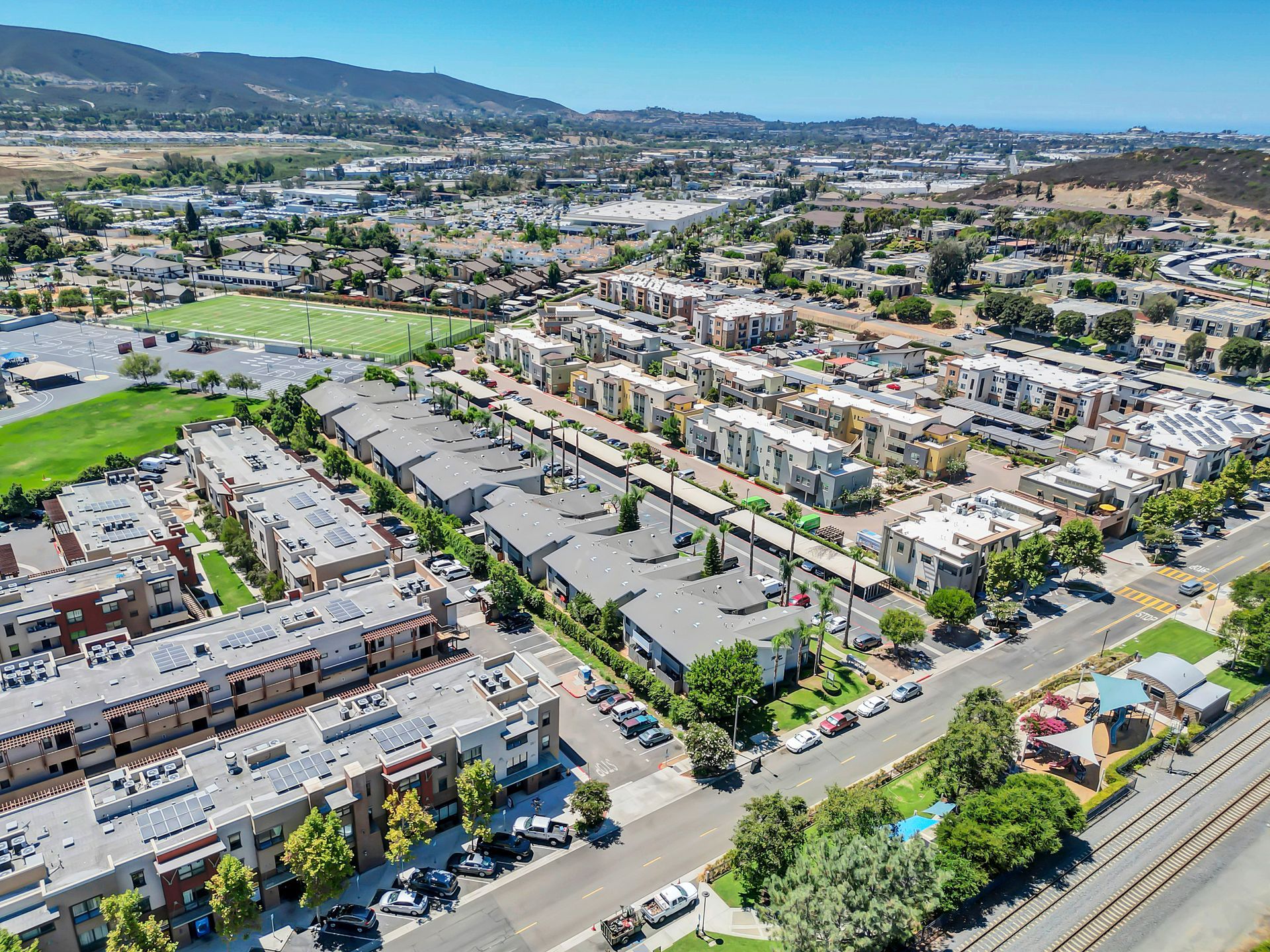 An aerial view of a city with a lot of buildings and trees.