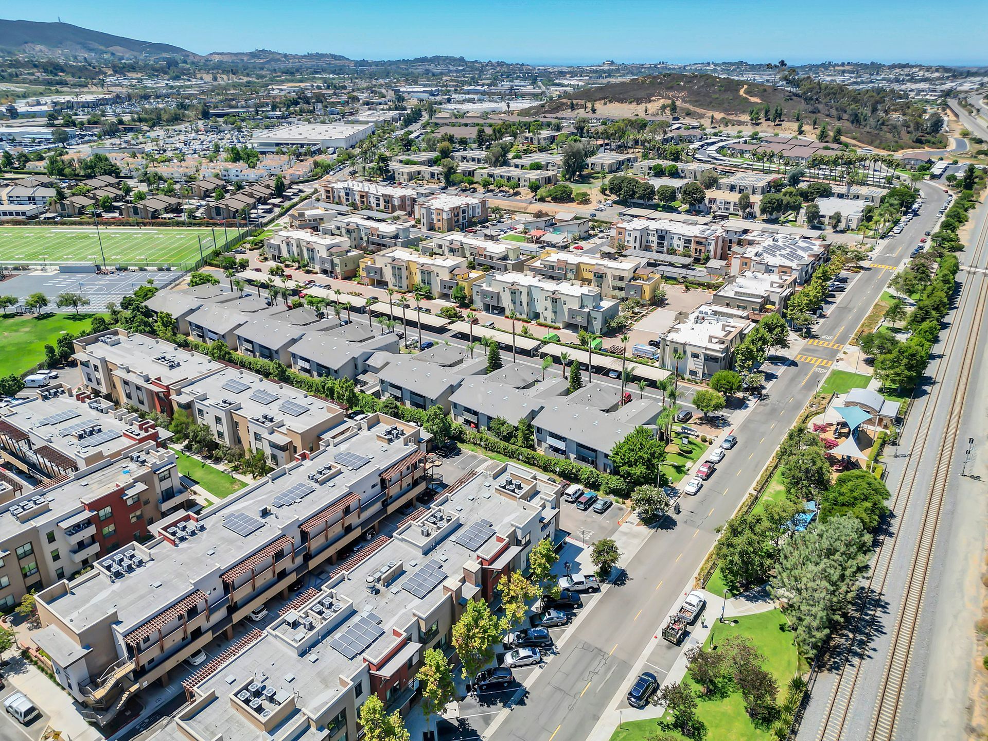An aerial view of a residential area with lots of buildings and trees