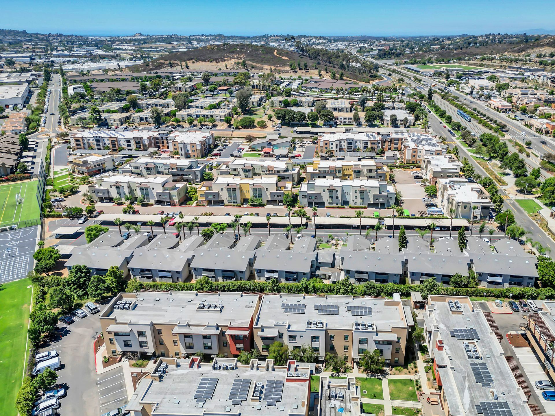 An aerial view of a residential area with lots of buildings and trees.