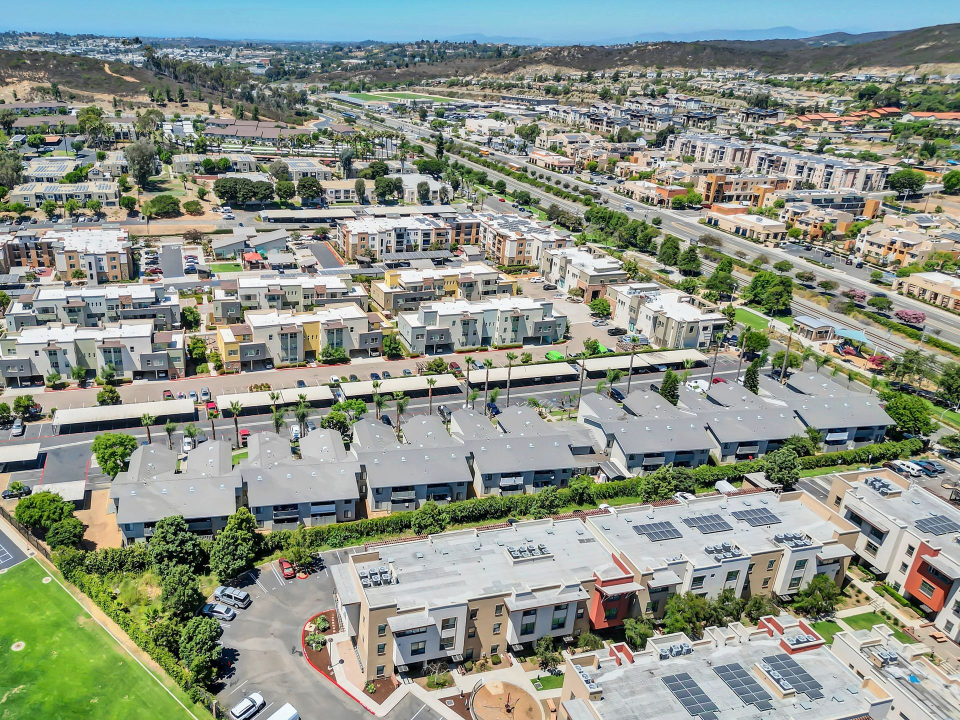 An aerial view of a residential area with lots of buildings and trees.
