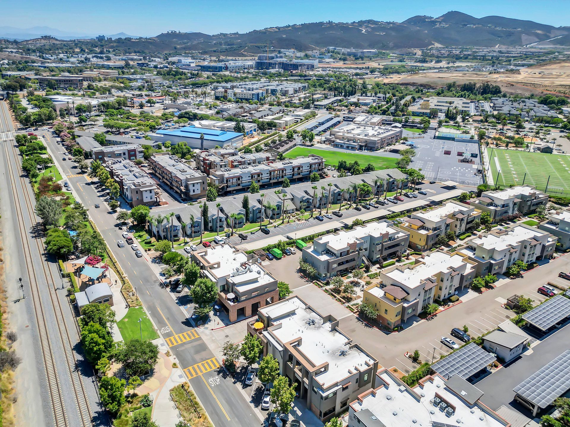 An aerial view of a city with a lot of buildings and trees