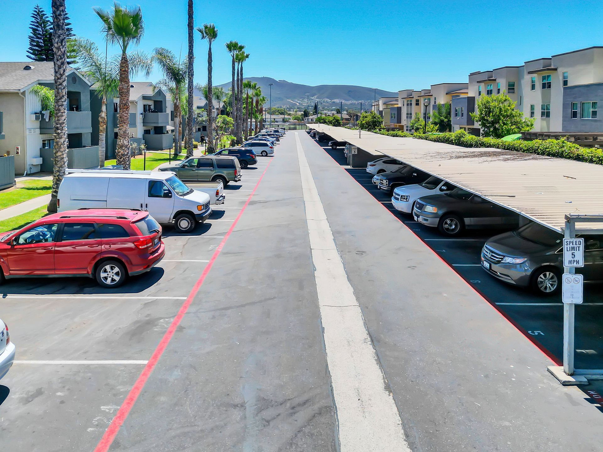 A lot of cars are parked in a parking lot