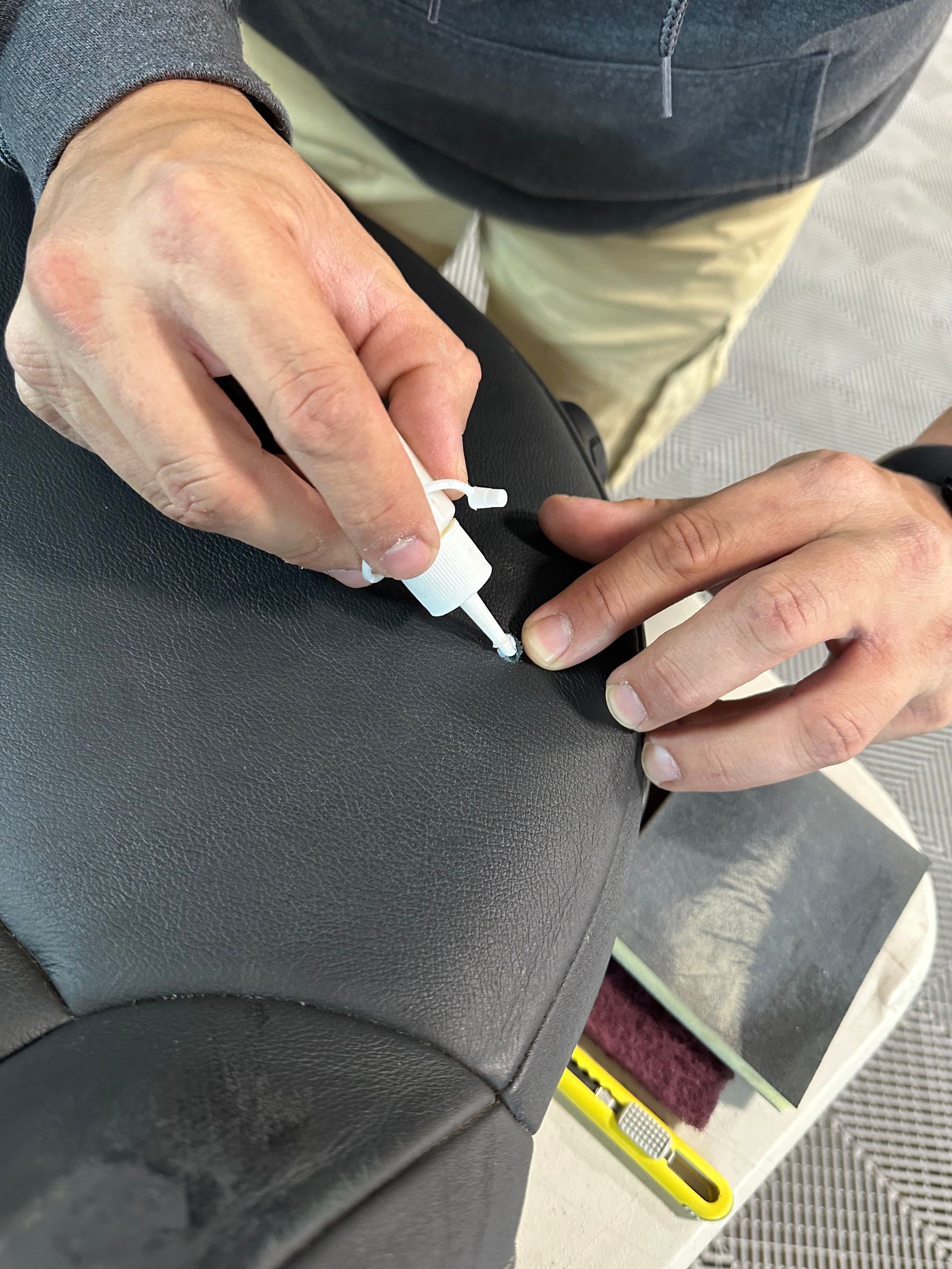 cleaning a car door with a towel .