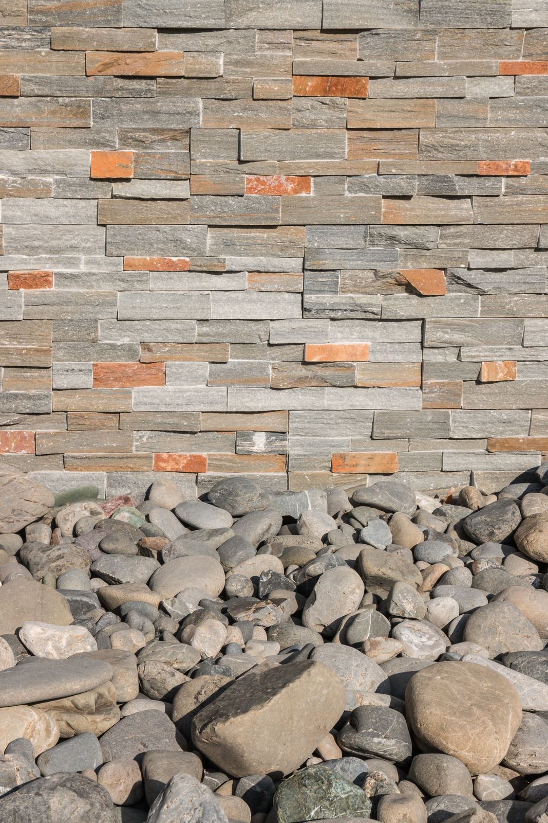 Bedroom with wood flooring, green accent wall, bed, and TV on a table by a window.