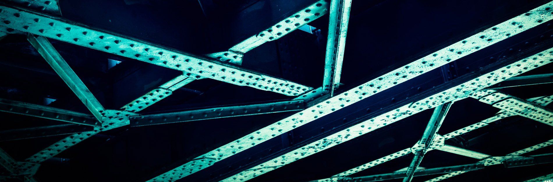 A close up of a metal structure in a dark room.