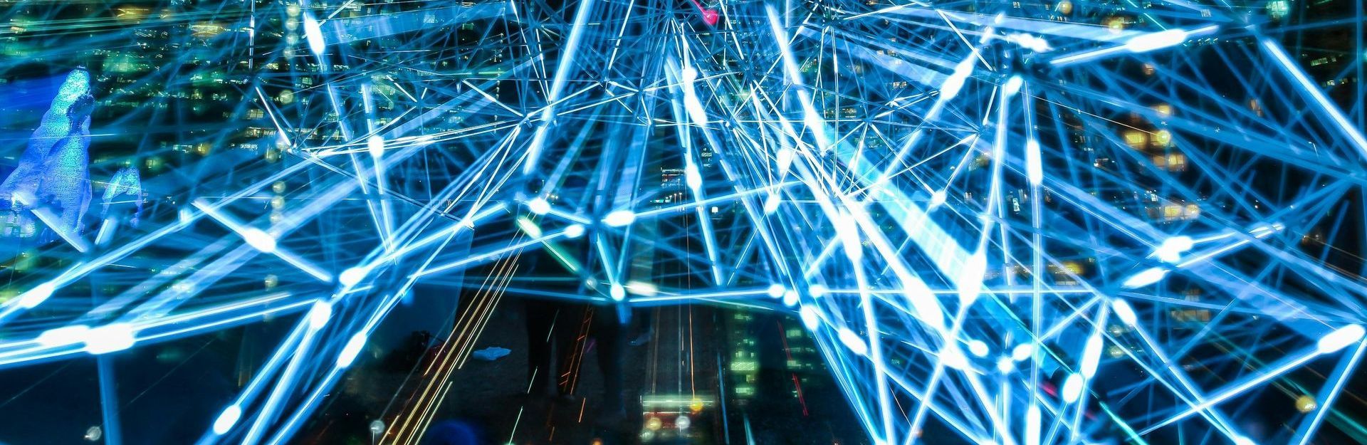 A computer generated city in lights at night.