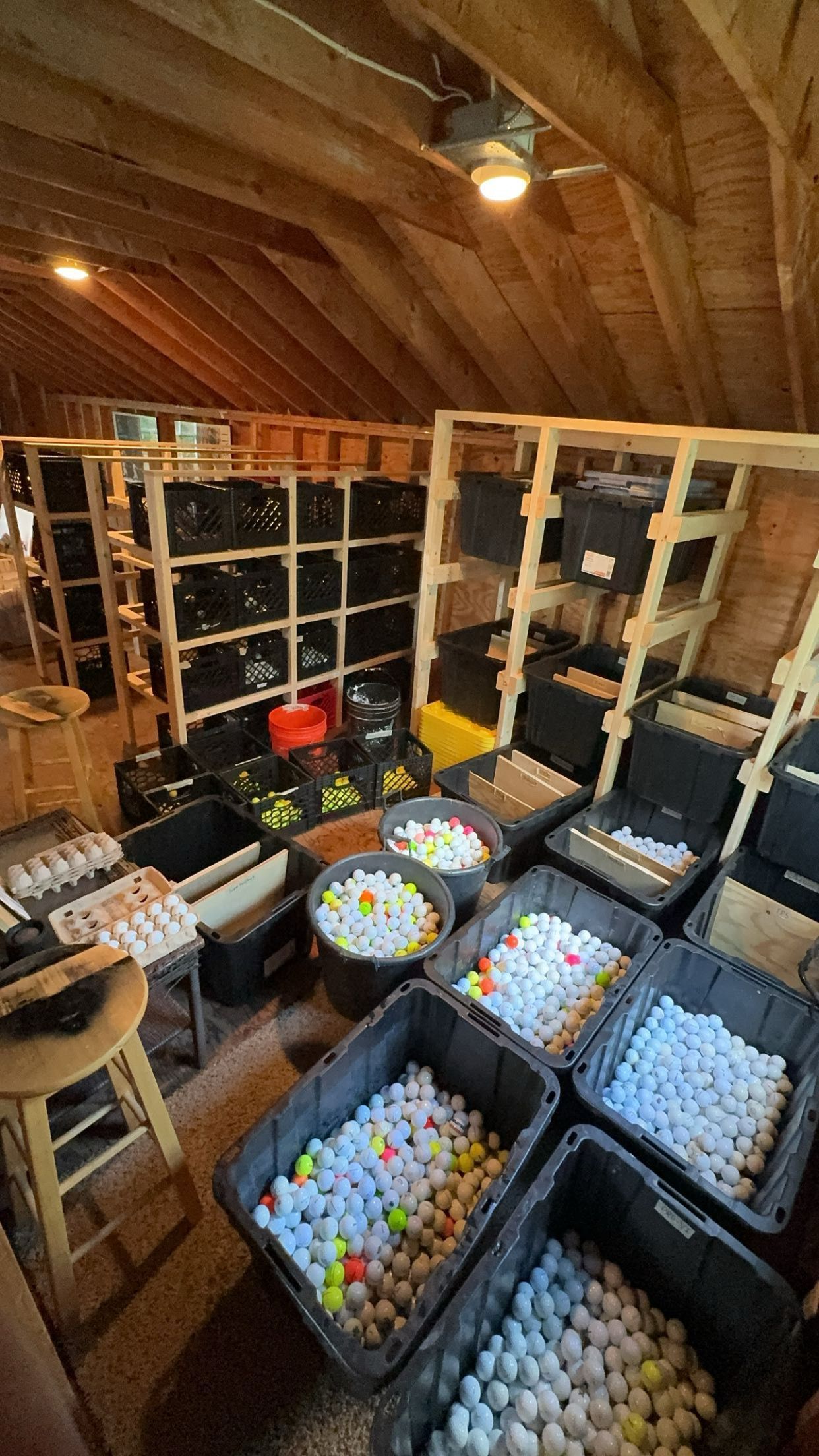 A room filled with lots of boxes of golf balls.