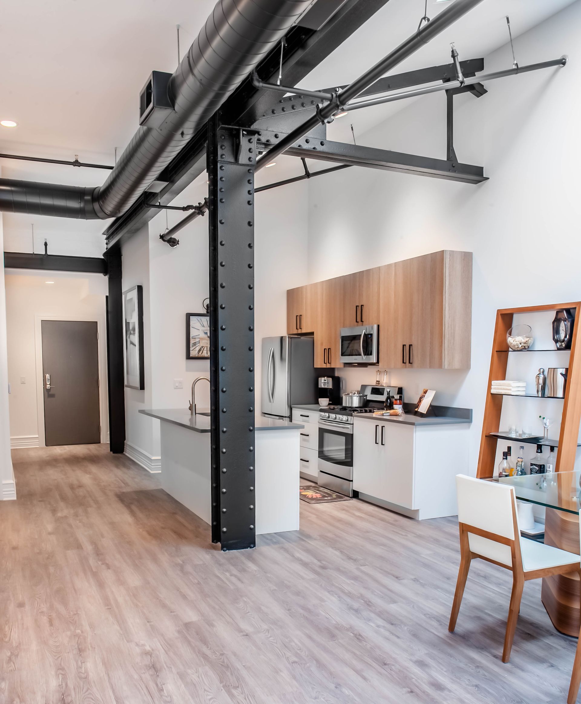 A kitchen with wooden cabinets and stainless steel appliances