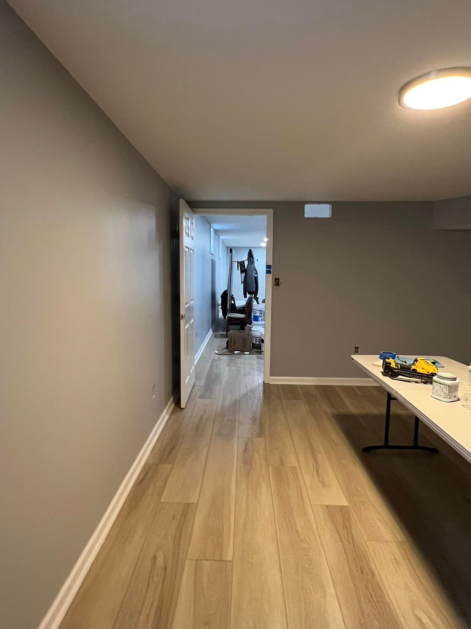 There is a table in the middle of the room.