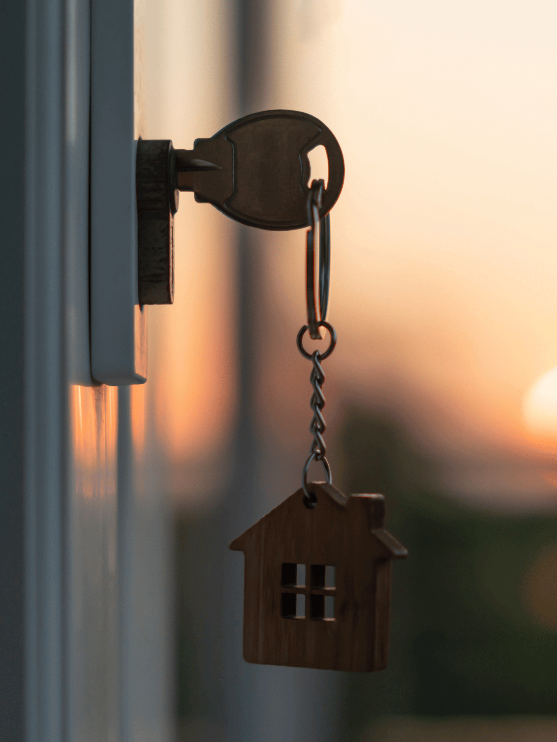 A key with a house keychain attached to it