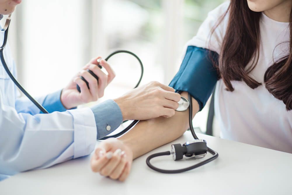 A Doctor Using Stethoscope to Check the Woman's Blood Pressure — AVI Protection Group Pty Ltd in Port Macquarie, NSW