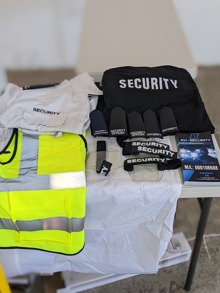 A Table With a Bunch of Security Equipment on It — AVI Protection Group Pty Ltd in Coffs Harbour, NSW