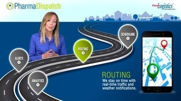 A woman is standing in front of a road and a cell phone.