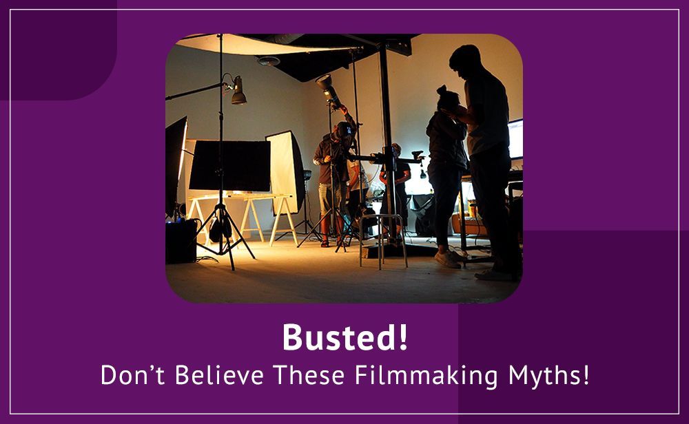 A group of people are standing in a room with a purple background.