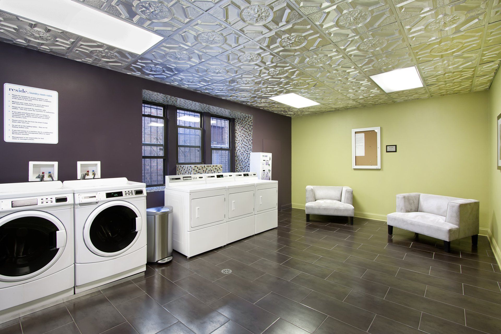 A laundromat with two washers and two dryers