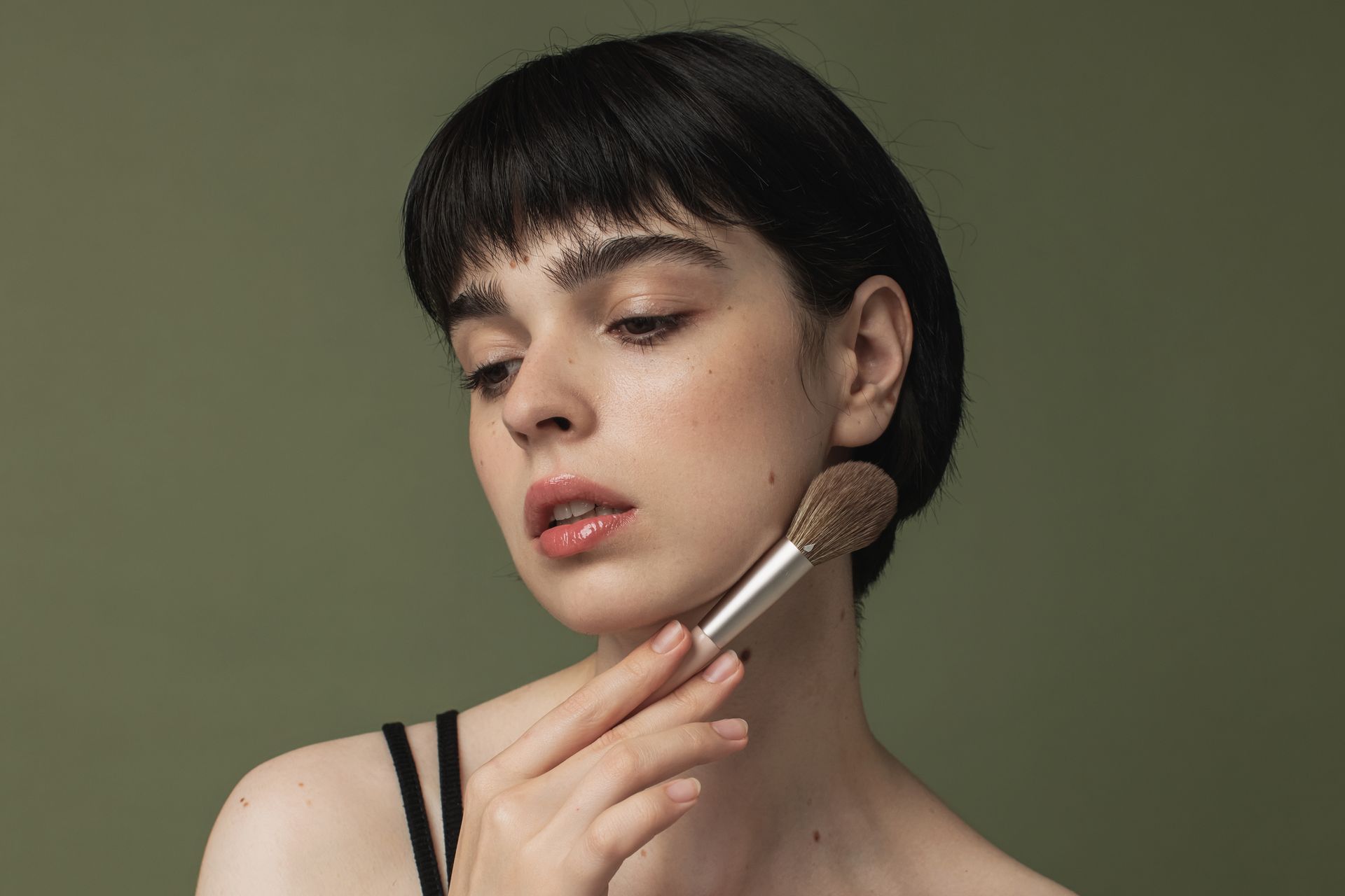Woman Applying Makeup — Scottsdale, AZ — Eyelash Extensions & Photography at BÁSACA Image Center