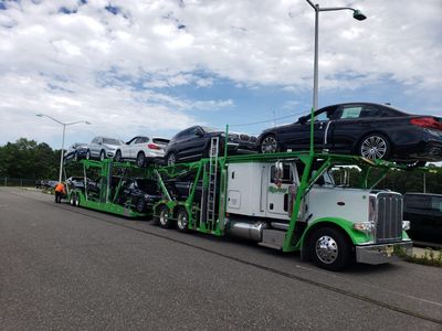 White truck transporting vehicles — Perth Amboy, NJ — Master Auto Transport
