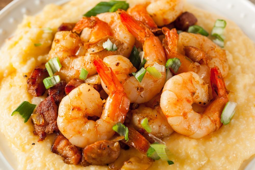 Shrimp and grits: Sauteed shrimp with green onions and bacon over creamy grits.
