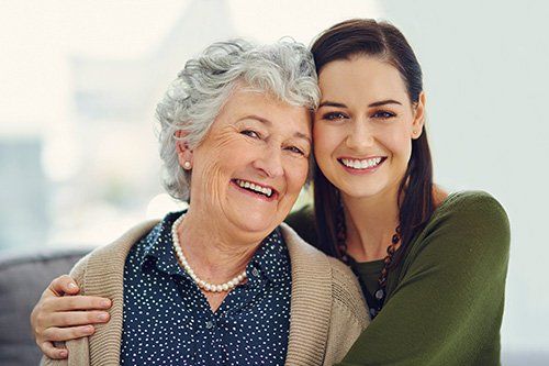 Elderly Woman and Daughter Smiling