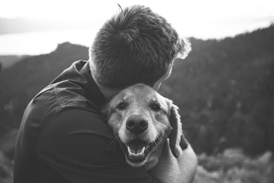 man-hugging-dog