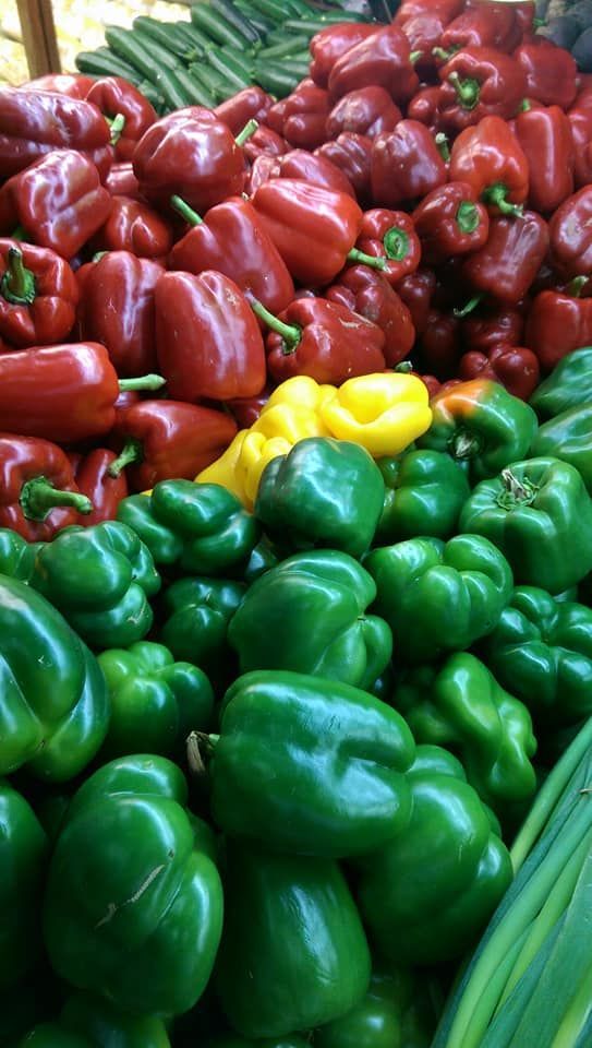 A Pile Of Green Peppers And Red Peppers On A Table — Caloundra Fruit Market In Caloundra, QLD