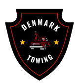 Denkmark Towing Logo, black shield with the words denmark towing and a tow truck with two stars
