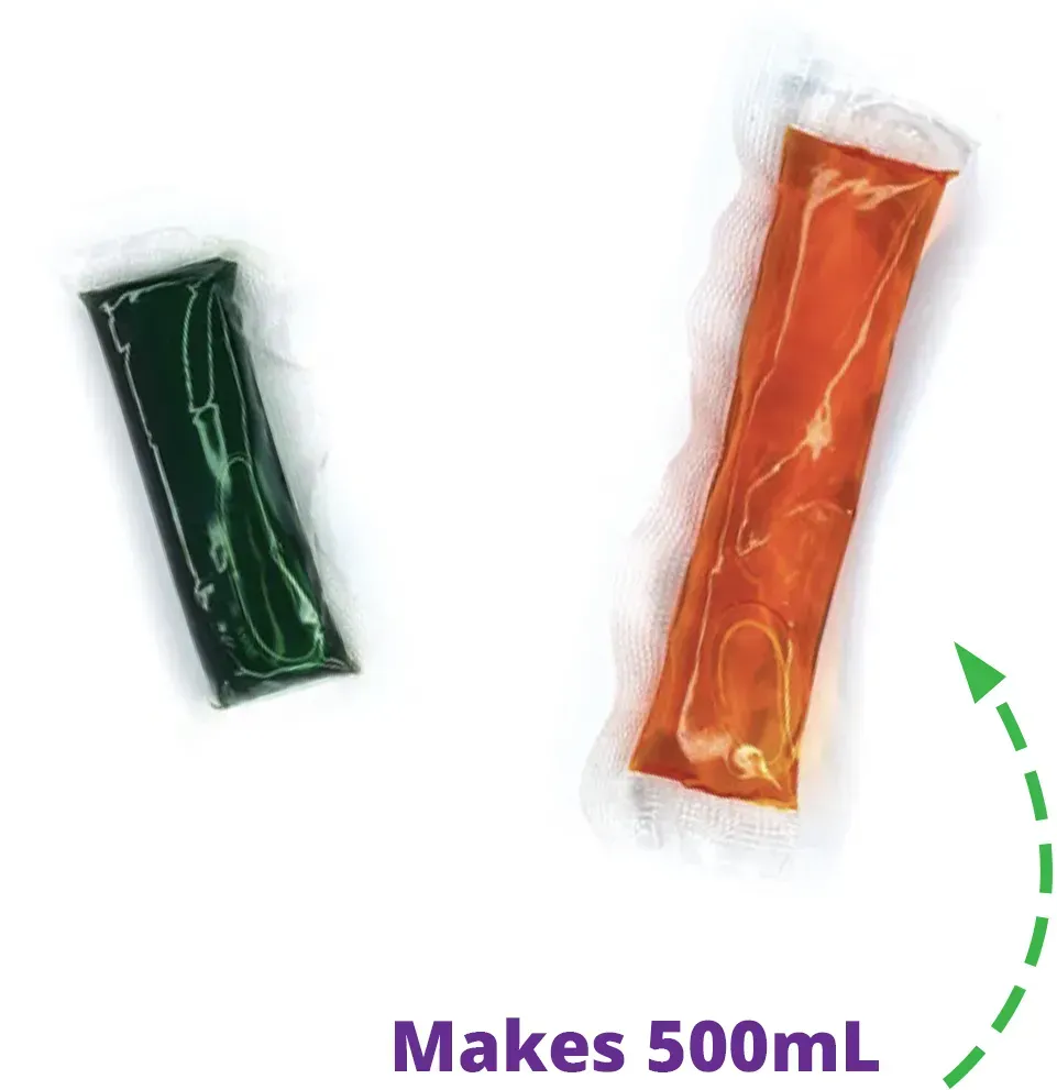 Two packets of liquid are sitting next to each other on a white surface.