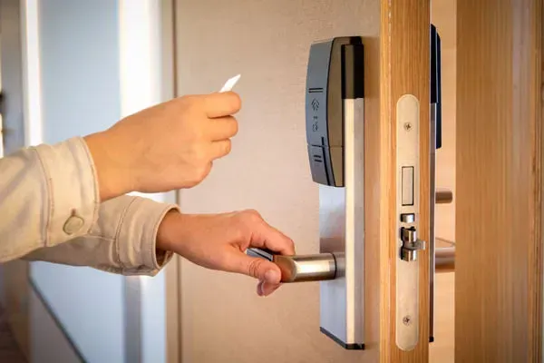 A white box with a green light on it.