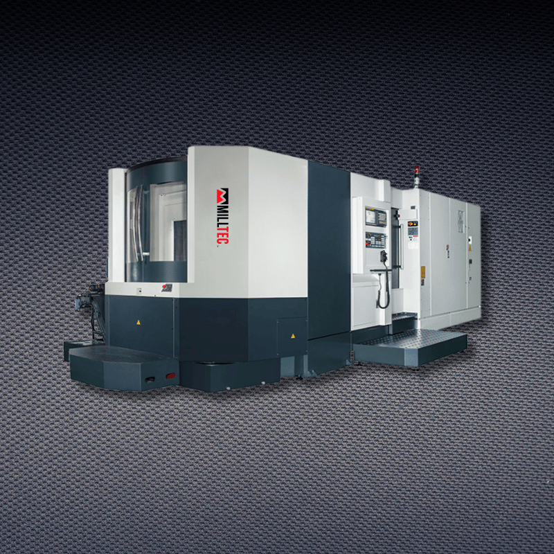 CNC milling machine in a dark industrial setting.