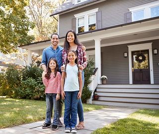 Happy Family Outside House — Greenwood, SC — Mabry Sanders Insurance Agency