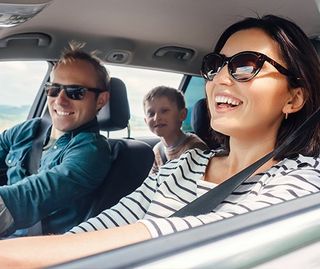 Happy Family Driving Car — Greenwood, SC — Mabry Sanders Insurance Agency